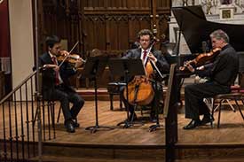 People playing string instruments. Part of the Brightmusic Society of Oklahoma.